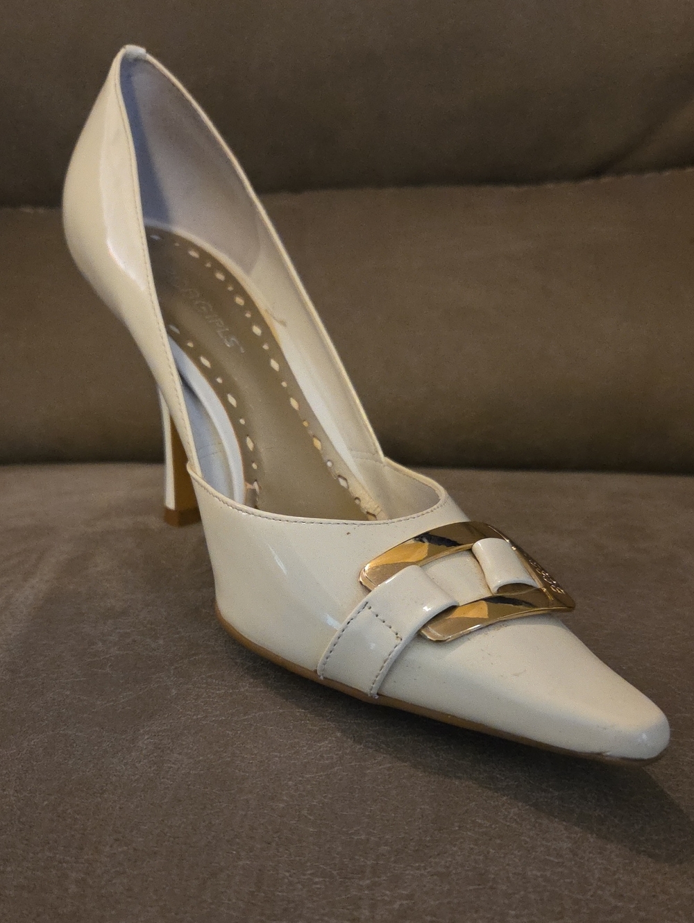 BCBGirls White Patent Pointed Toe Heel with Gold Buckle Accent